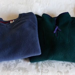 Two Ladies pull on fleece.